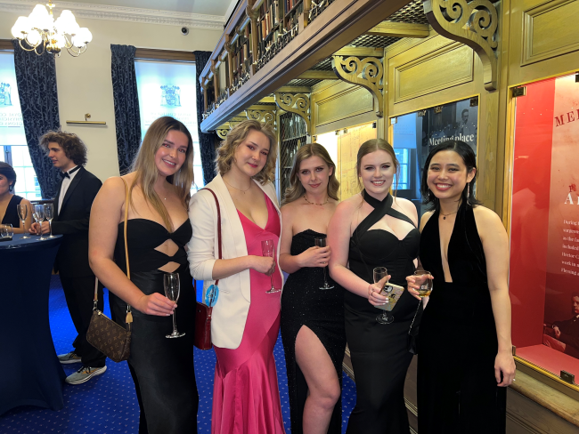 A graduation group photo in lower library